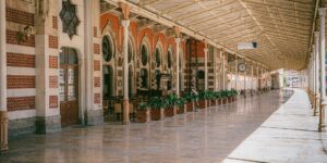 A scenic view of a restored historical train station platform bathed in soft sunlight.