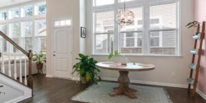 A brightly lit, accessible living room designed for senior comfort and safety.