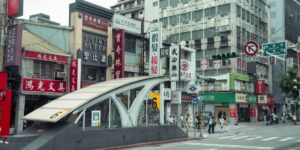 A modern urban intersection designed with high-contrast, accessible signage for improved pedestrian safety.
