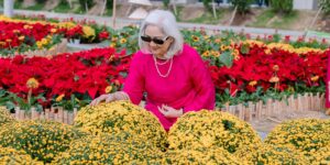 An active senior enjoying a sunny morning in a garden, representing healthy aging.