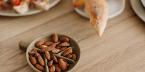 A serene bedroom scene featuring healthy snacks like almonds and pumpkin seeds on a table.