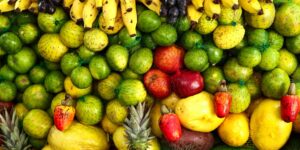 A selection of fresh, nutrient-dense fruits and vegetables rich in Vitamin C.