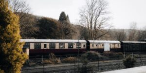 A scenic, historic train station platform during the morning, suitable for senior travelers.