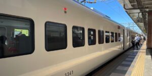 A comfortable and modern high-speed train carriage designed for accessibility.