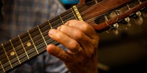 A close-up of a senior's hands practicing finger dexterity exercises.