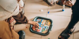 A group of older adults playing a strategy board game together.