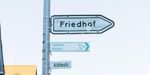 Modern city street with high-contrast wayfinding signage for improved accessibility.