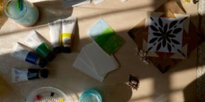 A peaceful watercolor painting setup in a sunlit studio.