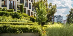 Modern intergenerational housing community with a shared garden.