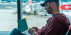 Senior couple using a travel app in an airport lounge.