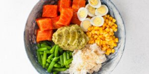 A balanced meal featuring eggs, salmon, and vegetables to represent dietary choline sources.