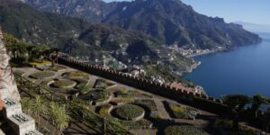A scenic view of an accessible historic villa terrace with smooth pathways and comfortable seating.