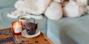 A cozy, well-lit scene featuring a jigsaw puzzle in progress on a wooden table, suggesting a relaxing and mentally stimulating hobby.