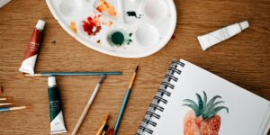 A peaceful watercolor painting setup on a sunny table.