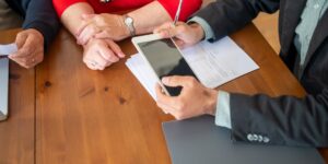 A senior adult safely managing digital finances on a tablet.