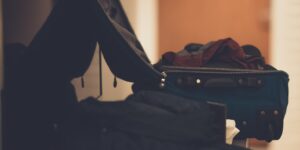 A clean, organized open suitcase with travel essentials for a comfortable overnight trip.