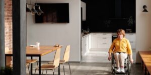 A bright, modern intergenerational community living space designed for accessibility and comfort.