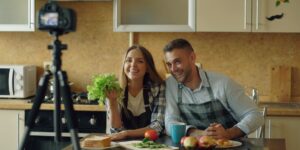 A healthy senior couple cooking a nutritious meal in a bright kitchen.