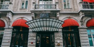 A modern, accessible boutique hotel entrance in a historic European city setting.