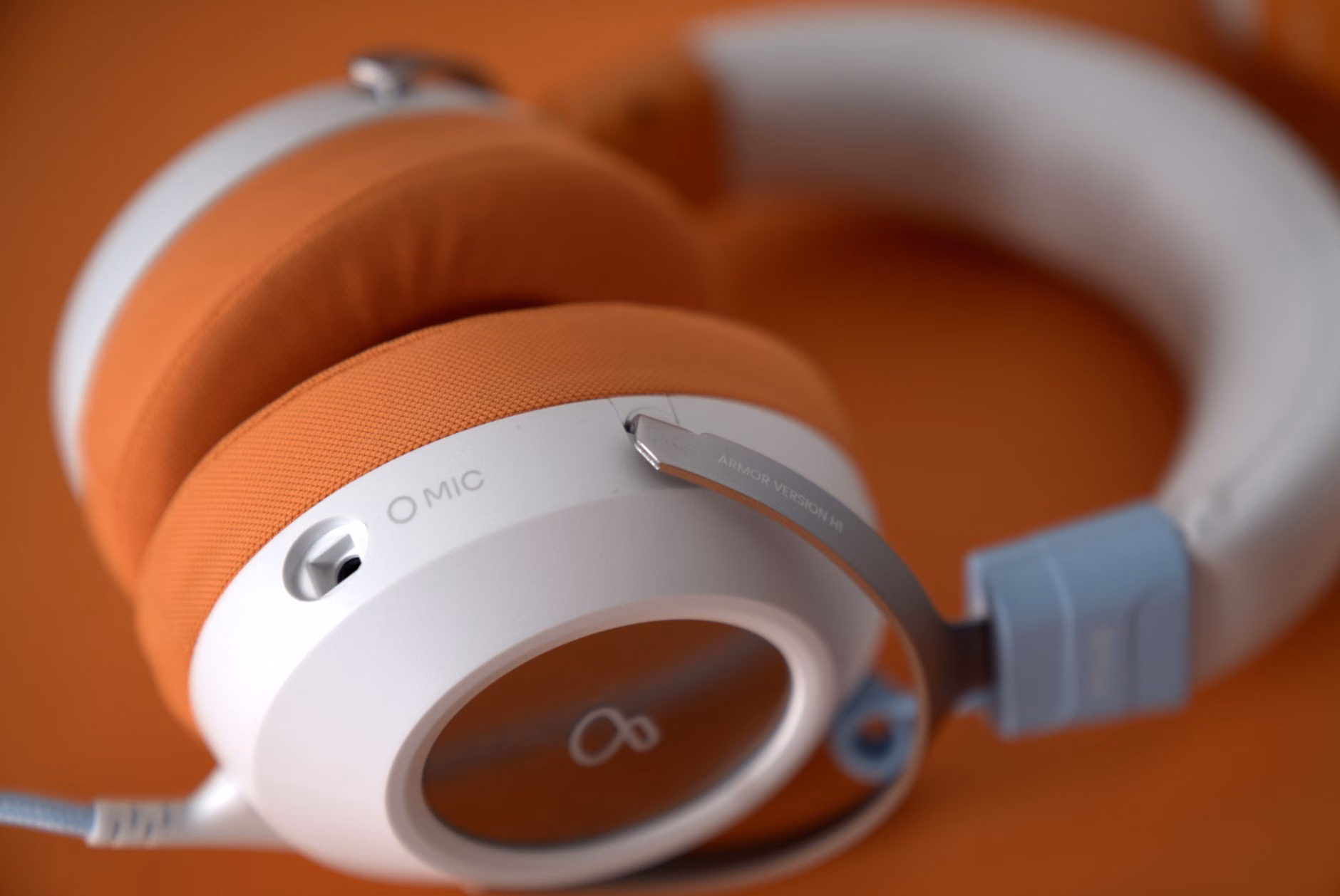 Close-up of a senior person adjusting noise-canceling headphones.