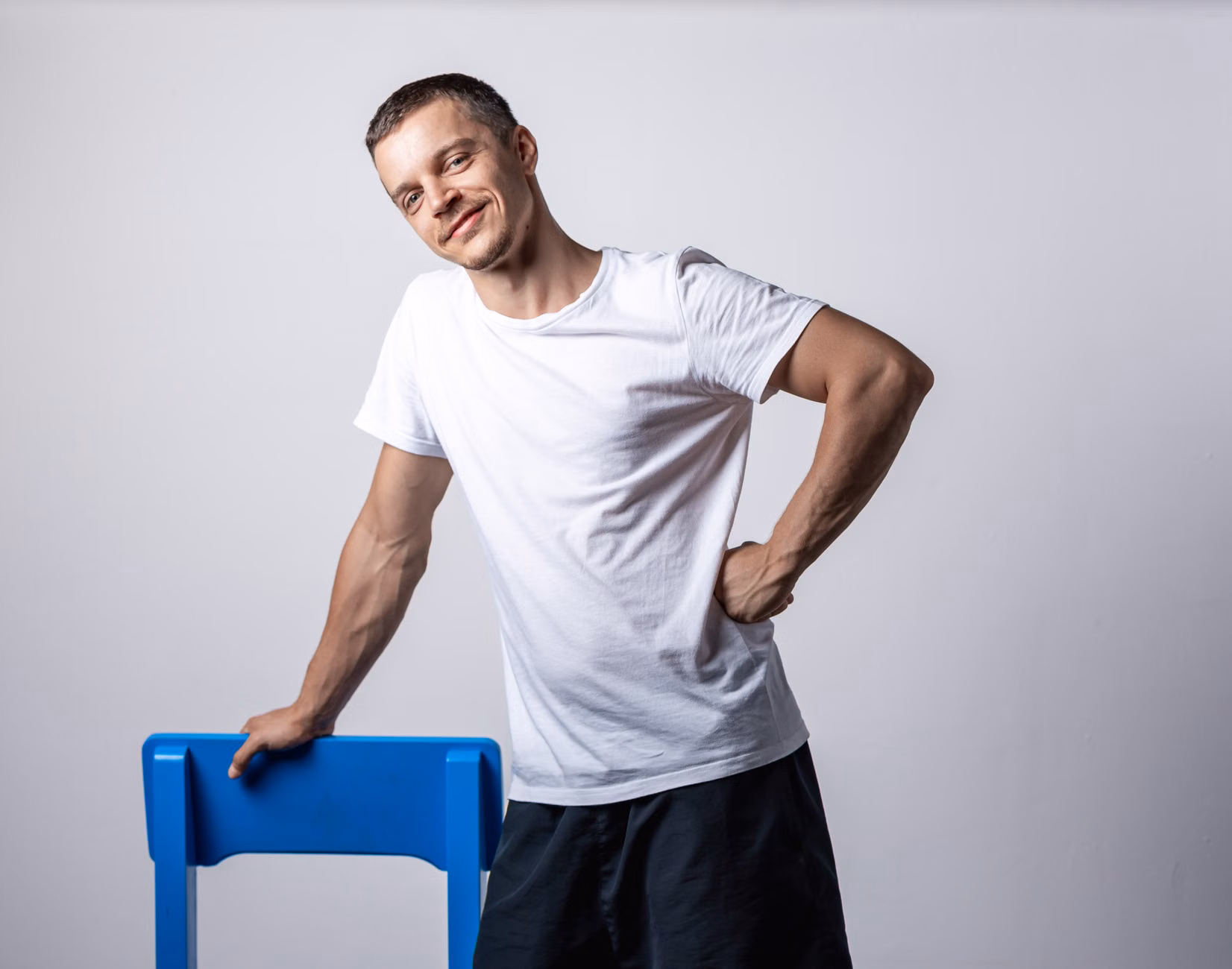 Starting position for seated scapular retractions showing upright posture.