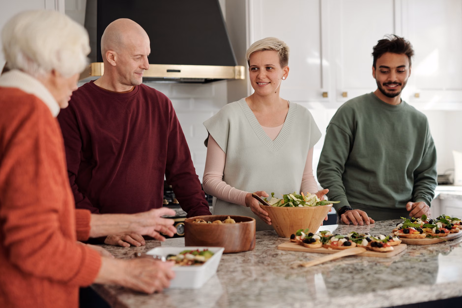 A modern, accessible kitchen shared by different age groups.