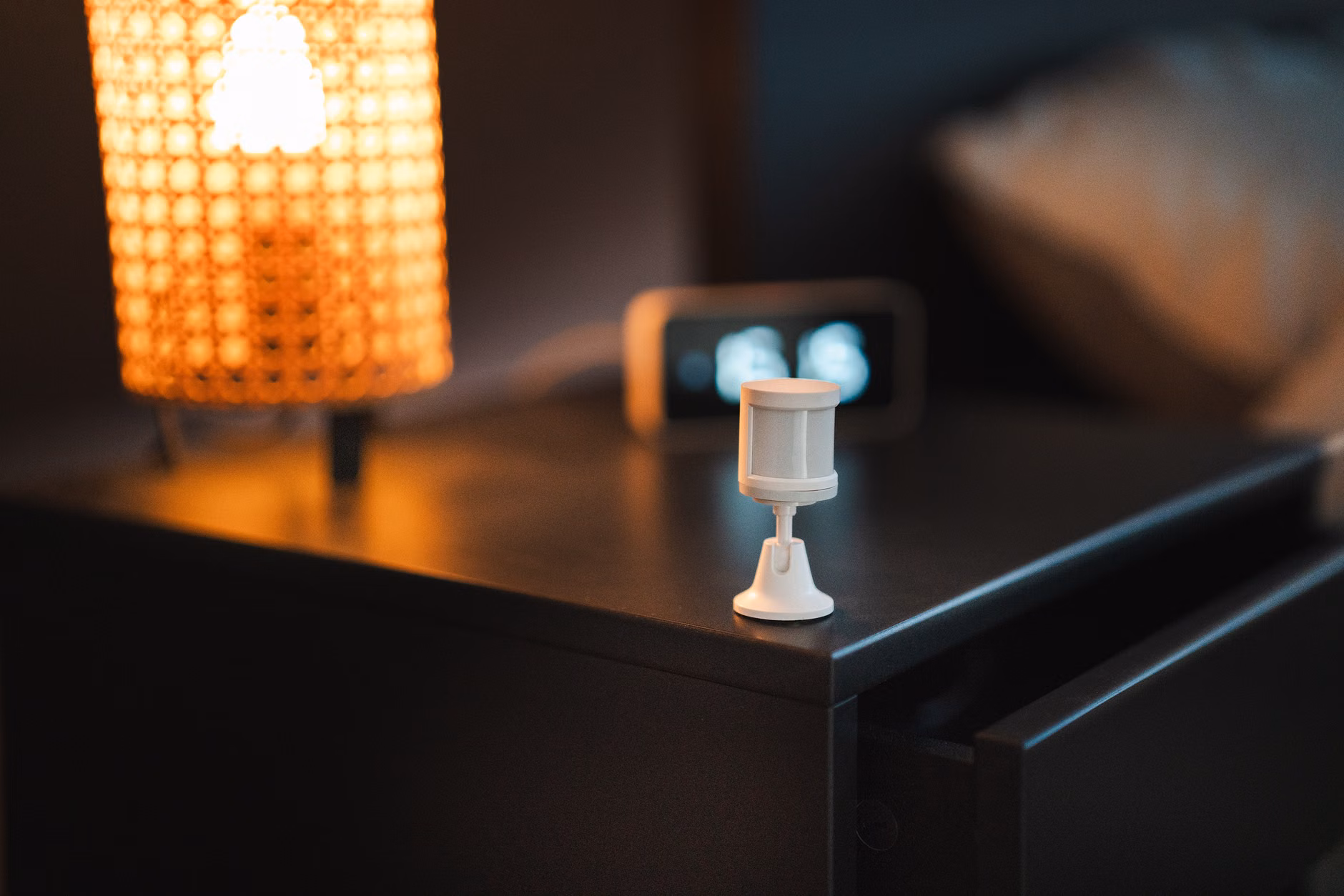 2026 AI-Assisted Remote Care: A Practical Guide for Seniors and Families 1 A wearable health sensor on a bedside table.