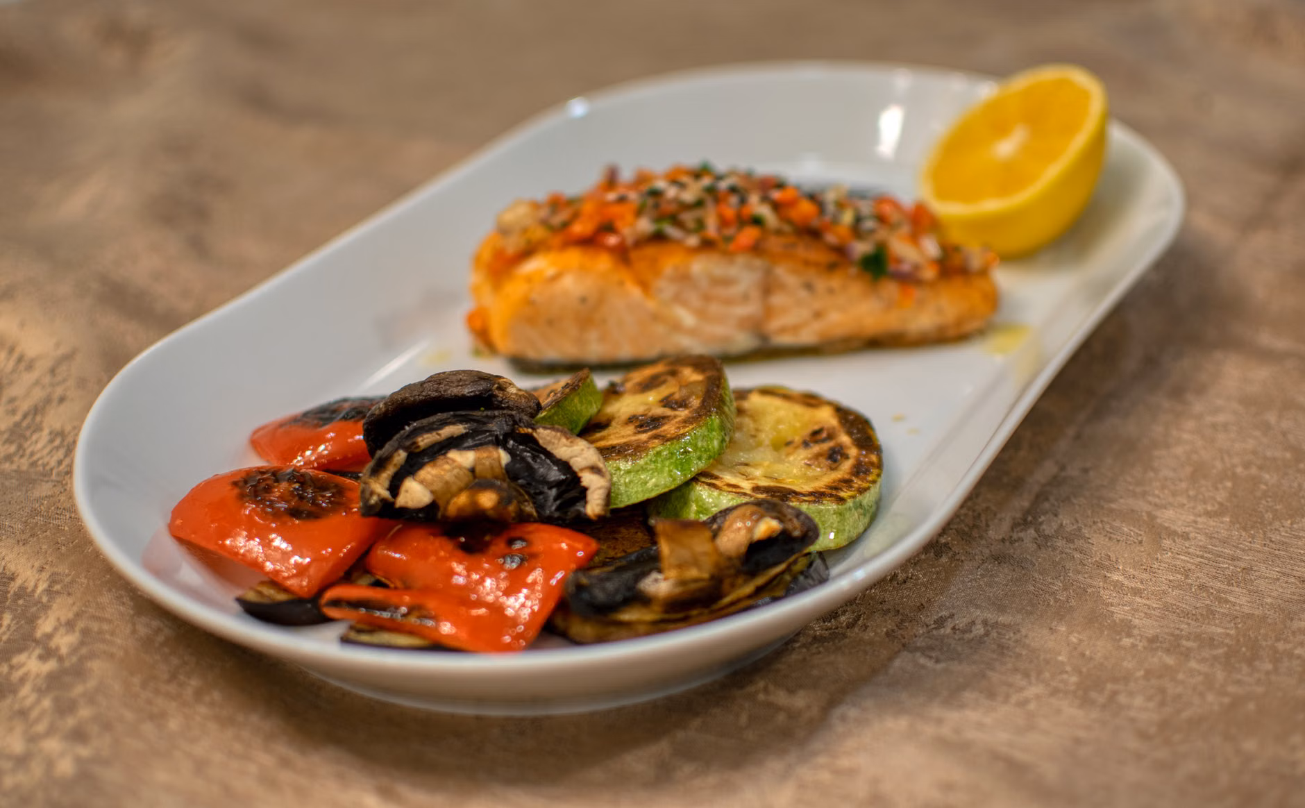 A balanced, nutritious meal featuring salmon and vegetables.