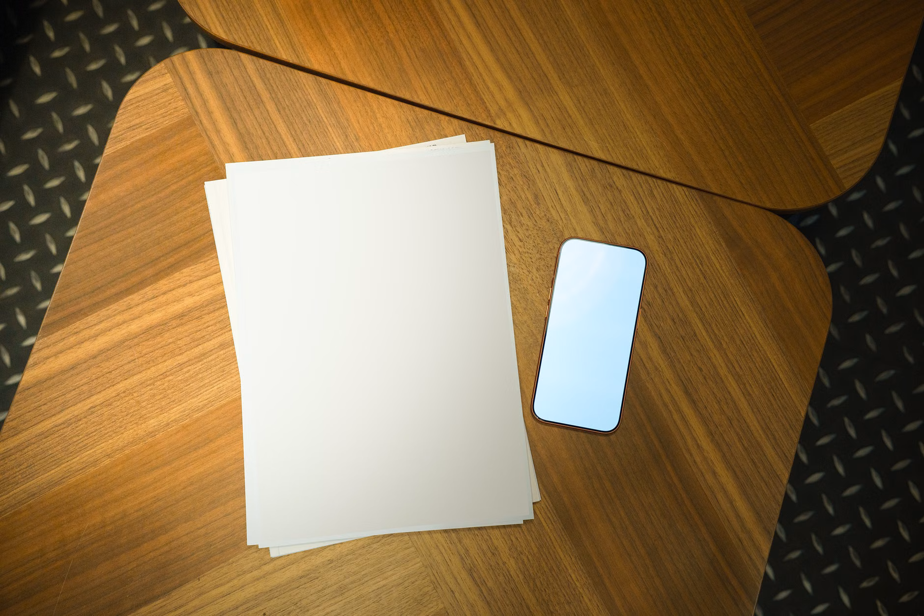 A dietary restriction card and smartphone on a dining table.