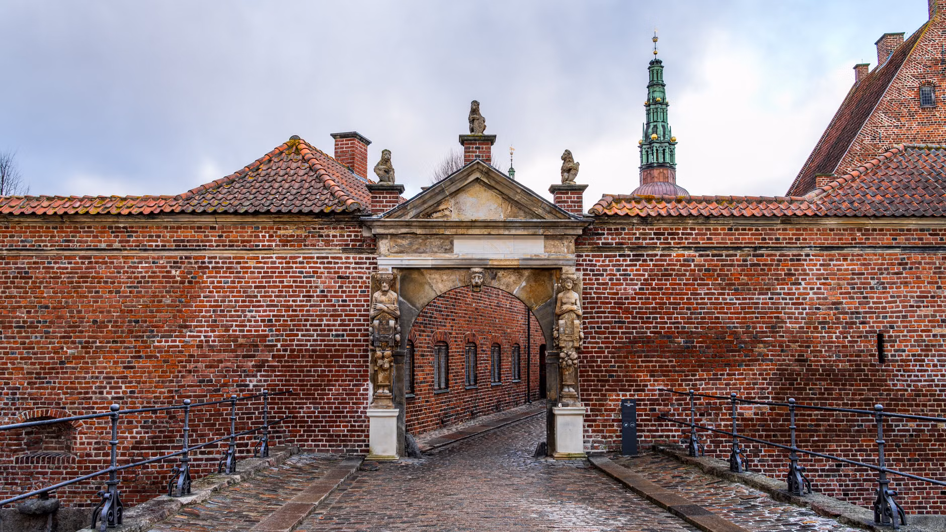 A gentle ramp providing accessible entry to a historic courtyard.