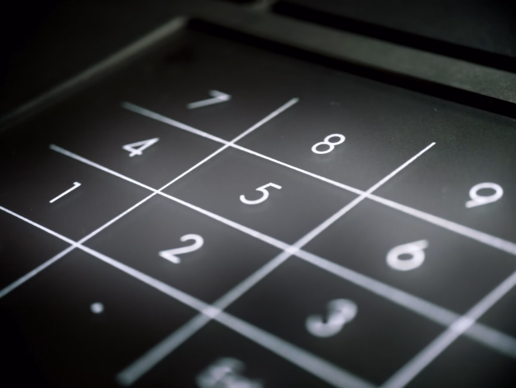 Close-up of a high-contrast, large-button digital kiosk interface.