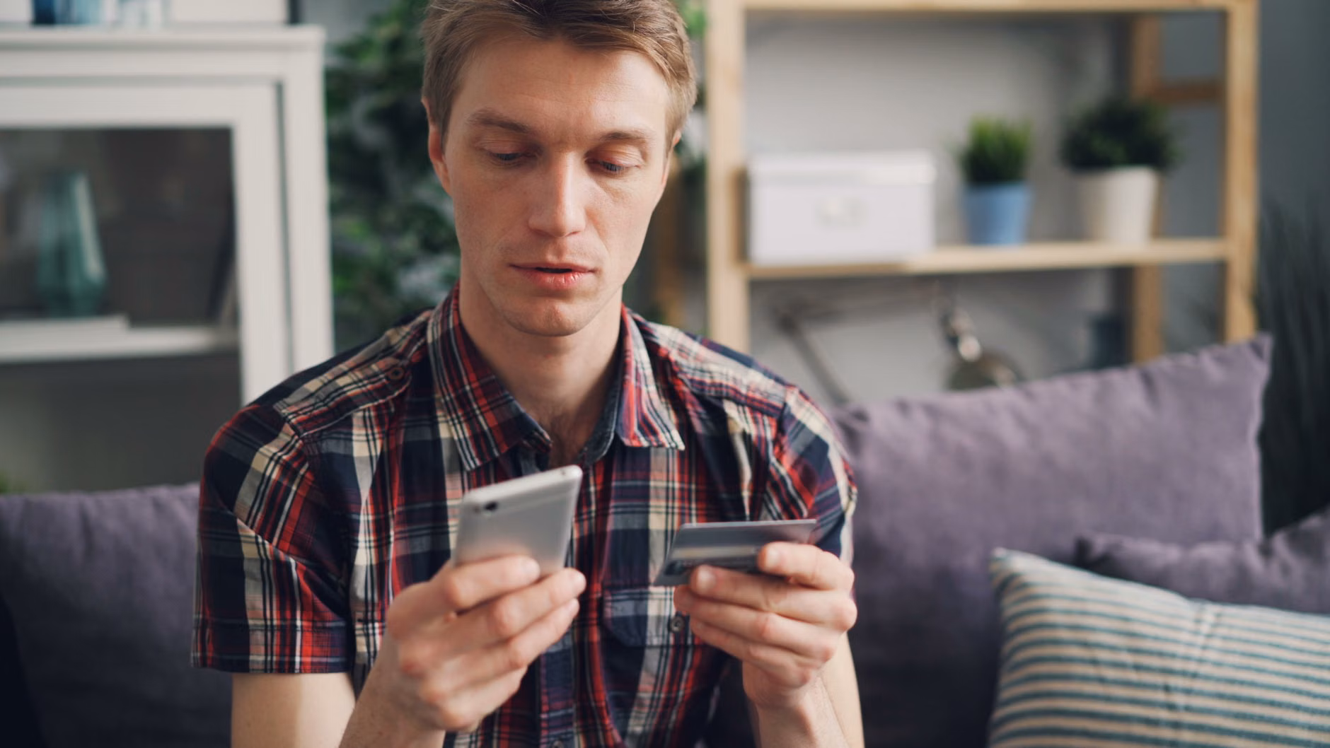 Person using voice-activated home technology for financial management.