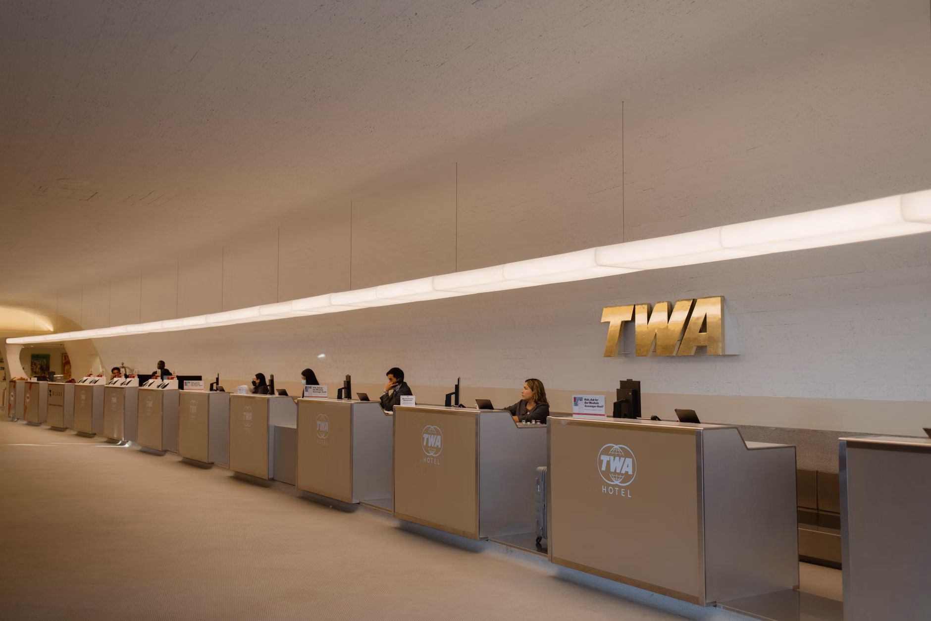 Mastering Airport Assistance: A Comprehensive Guide for Independent Senior Travelers 3 Senior traveler speaking with airport staff at a service desk
