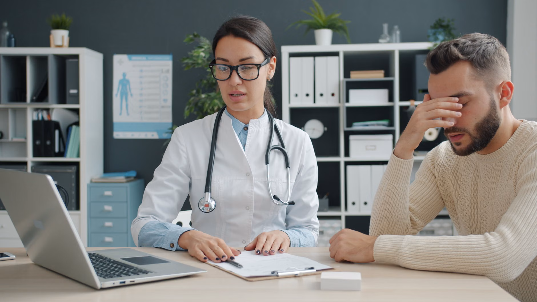 An older adult discussing health concerns with their healthcare provider.