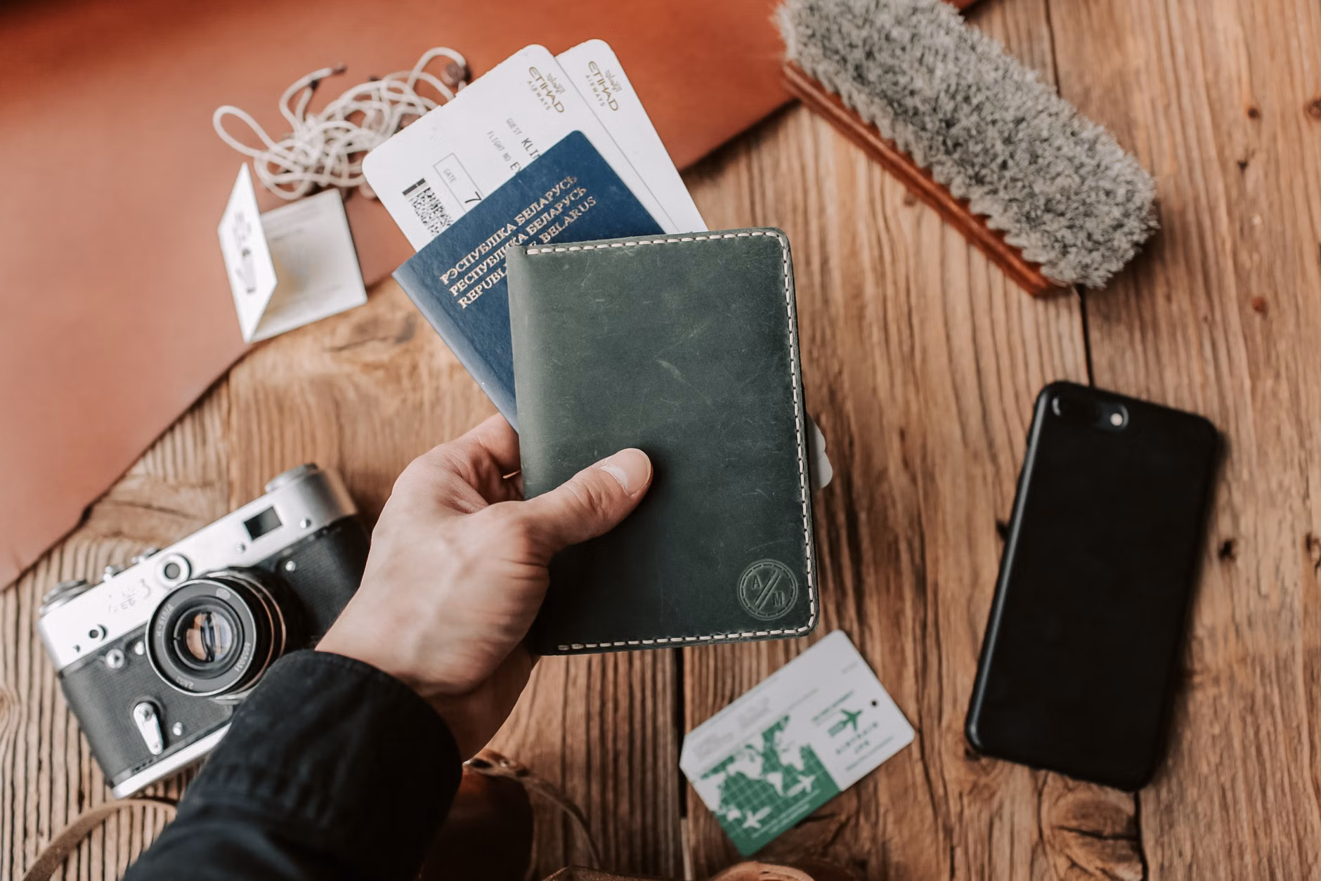 The Art of the Short-Haul Train Excursion: A Senior Traveler’s Packing Guide 3 A travel wallet with tickets and ID on a train tray table.