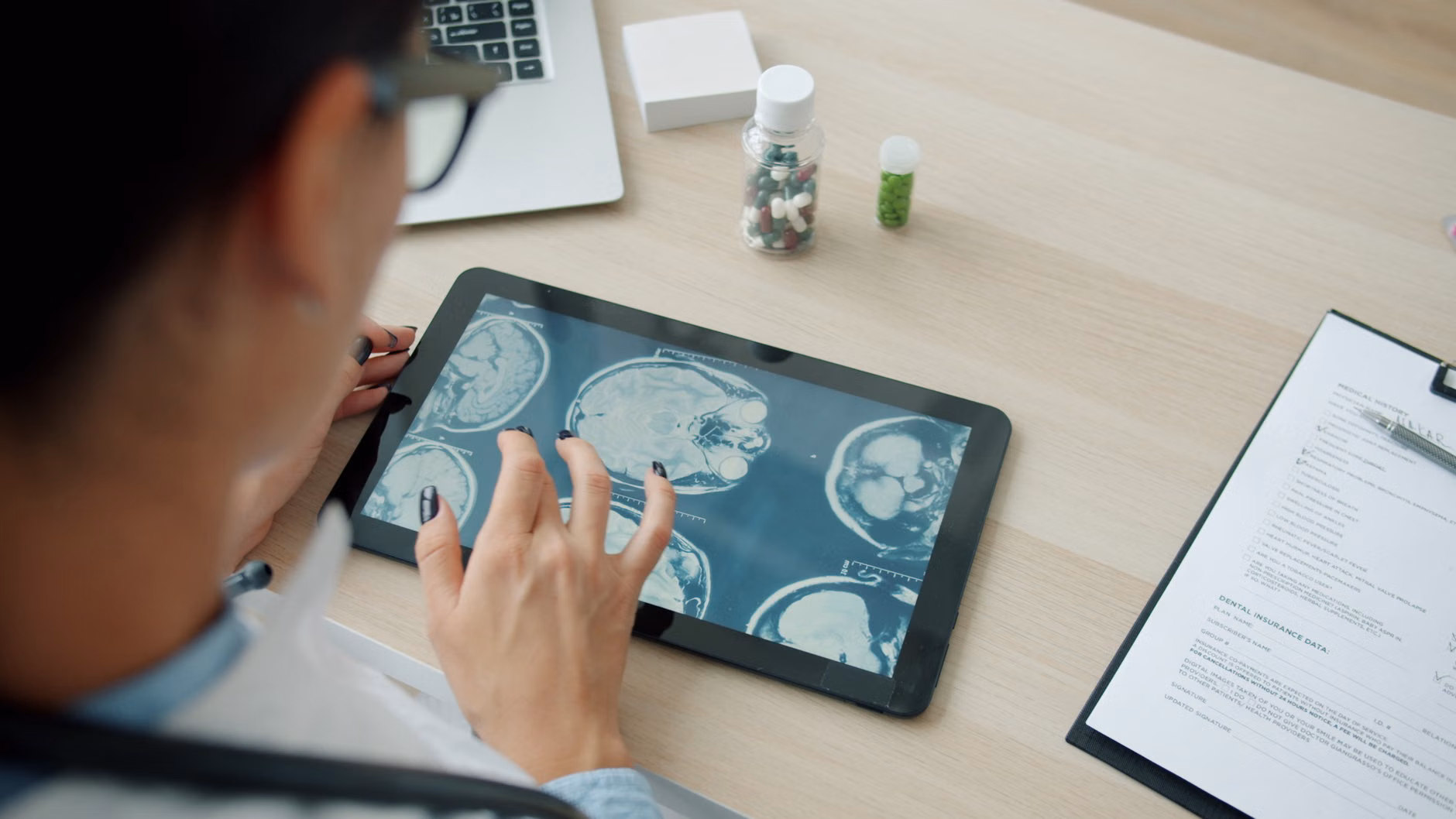A digital medical report showing health markers on a tablet screen.