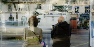 An older couple preparing for a comfortable bus tour at a scenic stop.