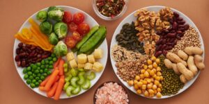 A selection of manganese-rich whole foods including nuts, seeds, and grains on a table.