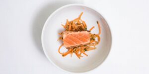 A healthy, nutrient-dense meal featuring salmon and vegetables, representing cognitive nutrition for seniors.