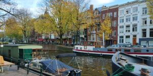 A scenic view of a canal boat traveling along a historic waterway.