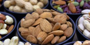 A selection of selenium-rich foods like Brazil nuts, fish, and grains on a kitchen counter.