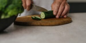 An older adult preparing a healthy, zinc-rich meal in a bright kitchen.