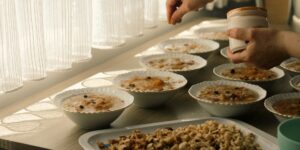 A healthy older adult preparing a nutritious meal in a modern kitchen.