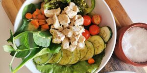 A nutritious, balanced meal consisting of fresh vegetables and whole grains on a wooden table.