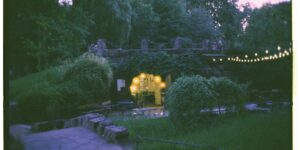 An inviting, safely lit park path at dusk designed for accessibility.