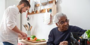 A healthy senior adult preparing a balanced meal in a modern kitchen.