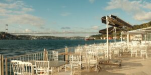 A scenic and accessible waterfront cafe terrace perfect for senior travelers.