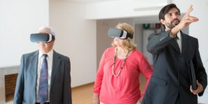 A senior couple enjoying a high-definition virtual museum tour from their home on a tablet.