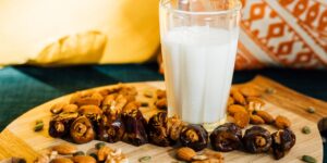 A selection of biotin-rich foods such as nuts, seeds, and salmon on a rustic table.
