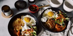 A spread of healthy, choline-rich foods including eggs, salmon, and vegetables on a kitchen table.